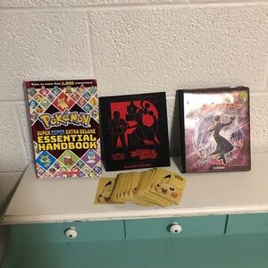 Pokémon books and card sleeves bundle